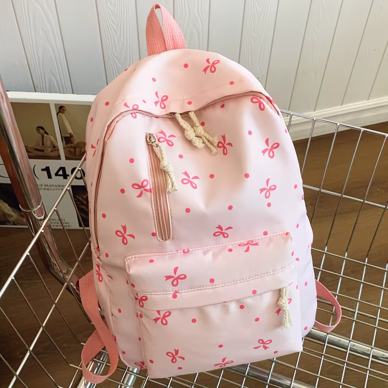 Sac à dos imprimé nœud ludique pour la rentrée scolaire, matelassé, multi-poches, bretelles réglable