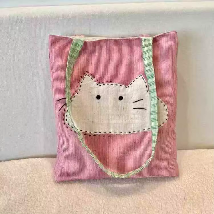 2025 nouveau sac en tissu à bandoulière unique japonais polyvalent et simple sac en toile pour femmes sac de transport artistique chat de dessin animé mignon